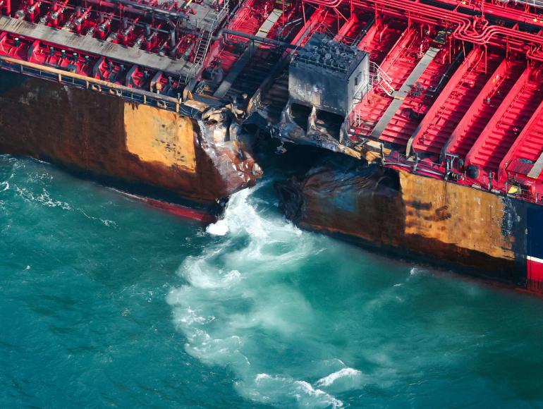 Water flows through a damaged hull of Stena Immaculate oil tanker ship after it collided with a cargo ship off the northeastern coast of England, Britain, March 11, 2025. REUTERS/Phil Noble TPX IMAGES OF THE DAY